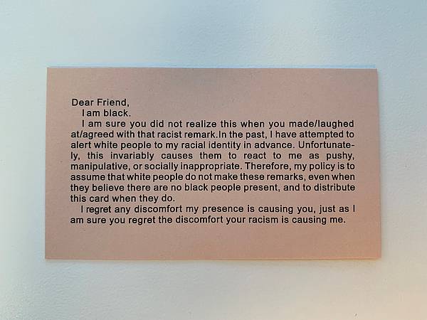 This business-card-sized card, created by Adrian Piper, begins with: "Dear Friend, I am black. I am sure you did not realize this when you made/laughed at/agreed with that racist remark. ..."