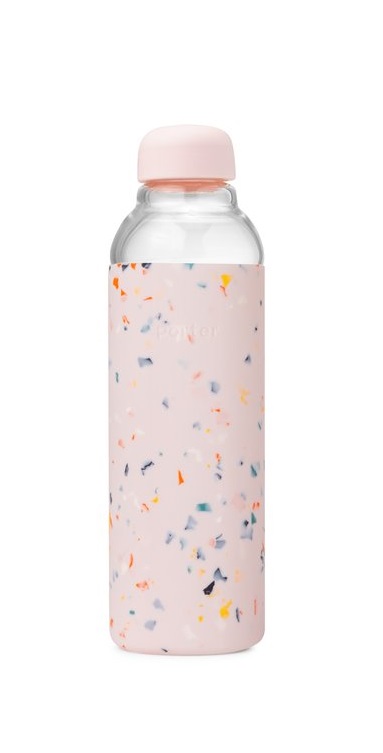 A glass water bottle covered in pink rubber