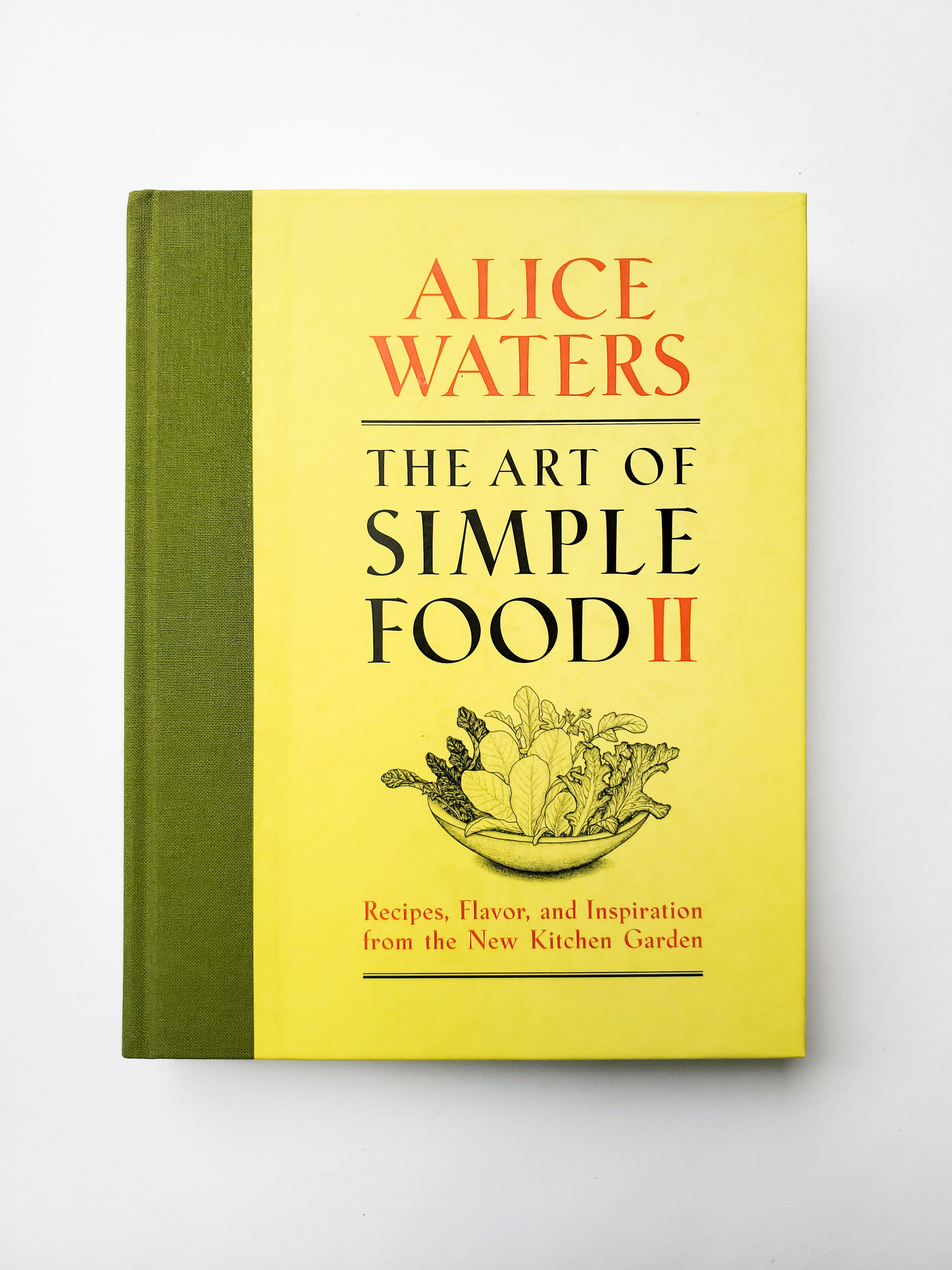 A book cover with the text 'Alice Waters. The Art of Simple Food II. Recipes, Flavor, and Inspiration from the New Kitchen Garden."