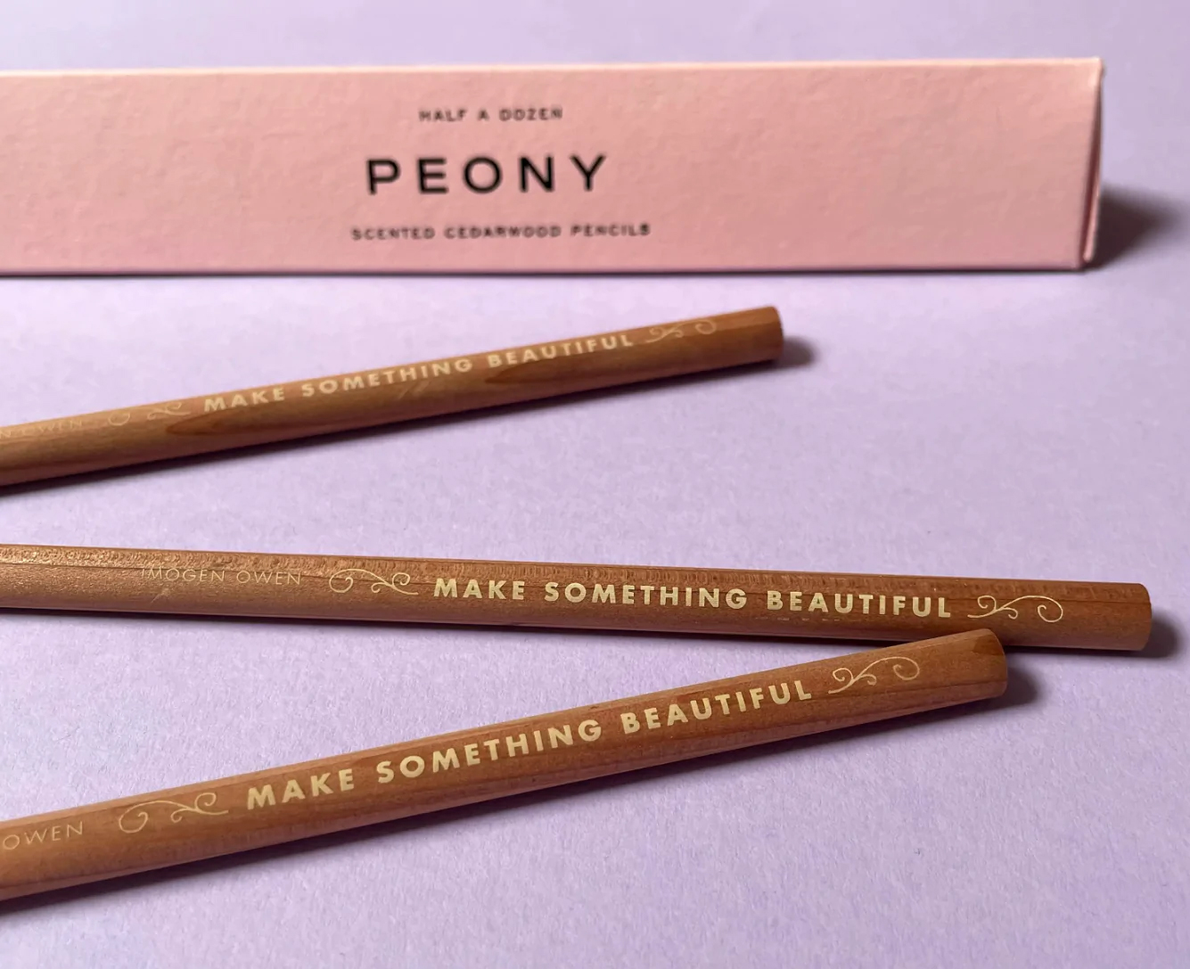Wooden pencils inscribed with "Make something beautiful"