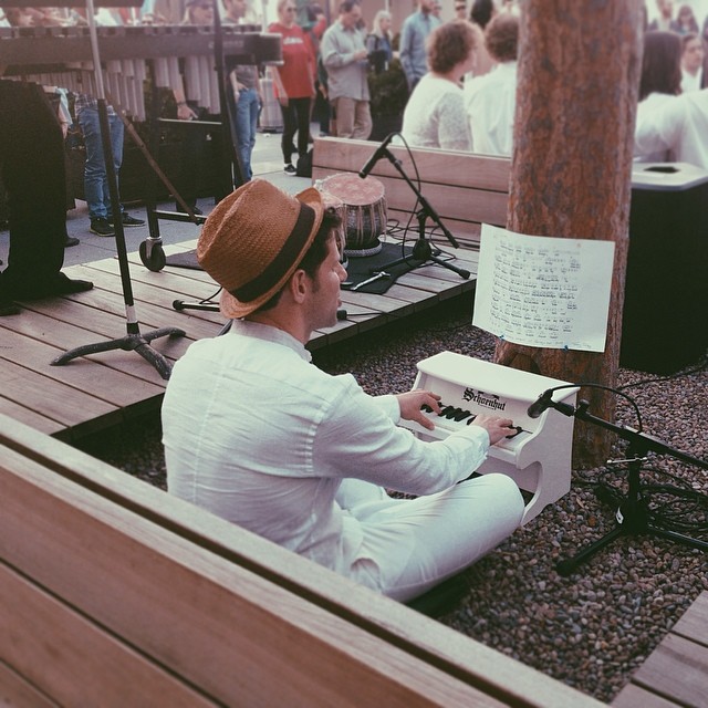 Yuval Sharon playing a toy piano. Photo by Instagram user @ashpurrr.