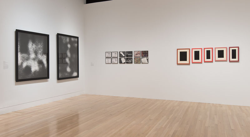 Left wall: two works by Allan McCollum titled "Perpetual Photo," 1982; right wall, from left to right: Silvia Kolbowski, "Model Pleasure III," 1983, and Allan McCollum, "Collection of Five Plaster Surrogates," 1982/1990. Installation view at the Hammer Museum, Los Angeles