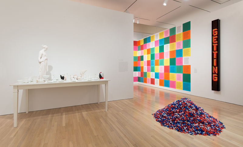 On left: Fred Wilson, "Love and Loss in the Milky Way," 2005; on floor, Felix Gonzalez-Torres, "'Untitled' (USA Today)," 1990; right wall, from left to right: Jenny Holzer, "Inflammatory Essays," 1979–81, and "Laments: I am a man . . . ," 1987. Installation view at the Hammer Museum, Los Angeles