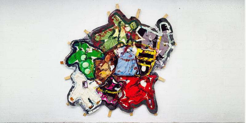 Oddly shaped painting covered with kids Halloween costumes