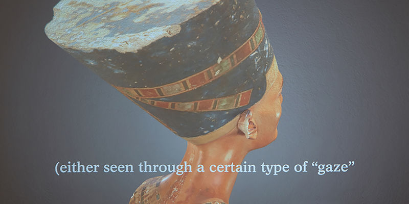 The back of an Egyptian bust sculpture, with a subtitle reading "Either seen through a certain kind of 'gaze'