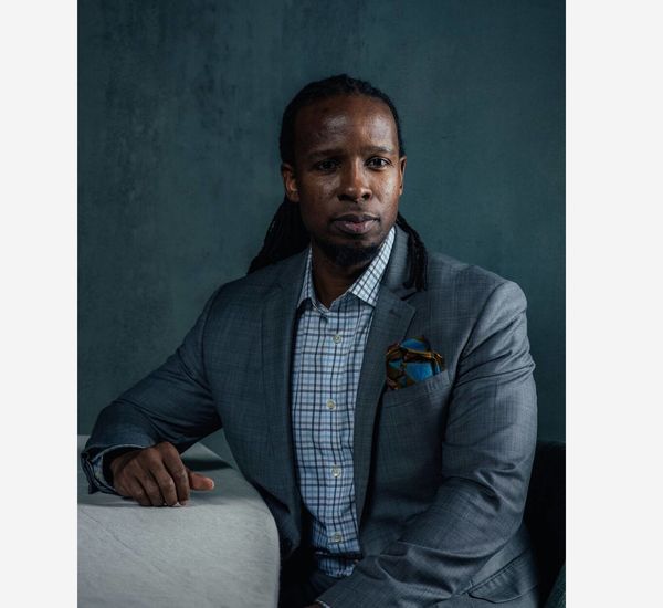 Portrait photograph in color of Ibram X. Kendi