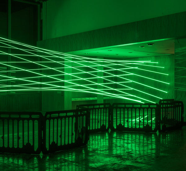 Green lasers fill a room