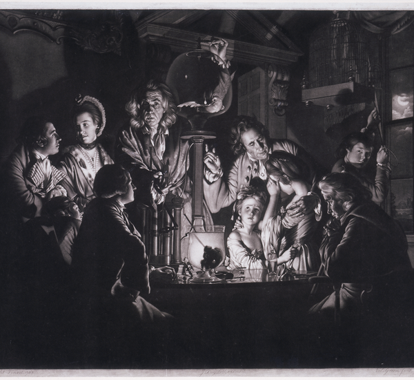 Scene of people surrounding an old time air pump