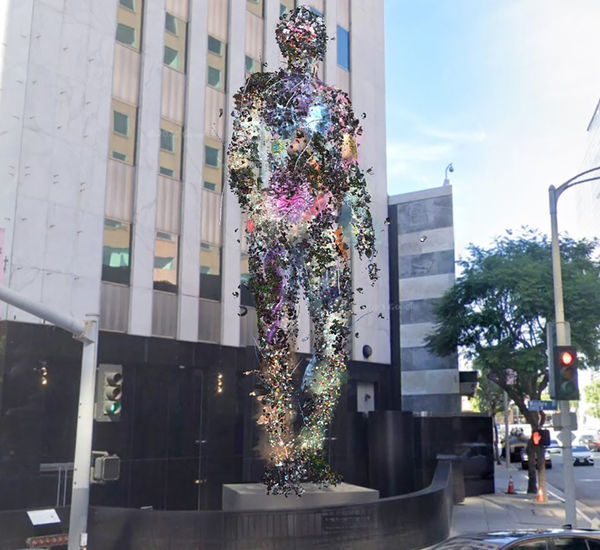 Rendering of a towering digital sculpture of a figure standing on an outdoor plinth