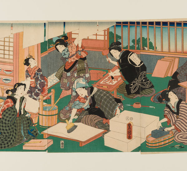Woodblock of women making woodcut prints in a studio