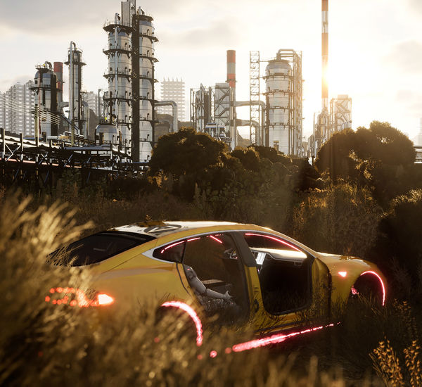 A dismantled yellow sportscar sits in a field