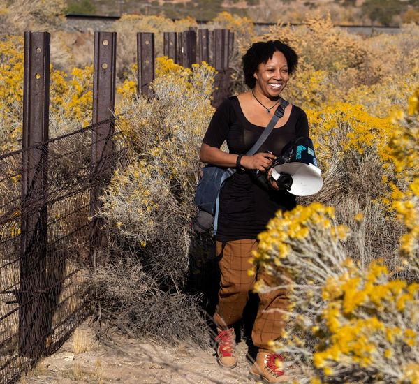 Krystle Hickman among yellow wildflowers