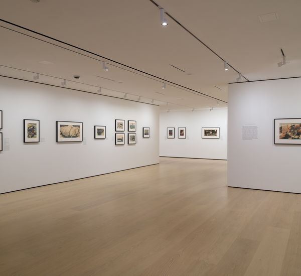 Gallery with framed works on paper installed on walls