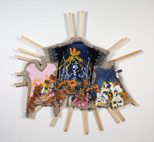 Multicolored material hanging on approx. 16 wood bars