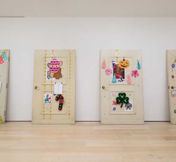 Four hugely oversized doors decorated in the style of the seasons