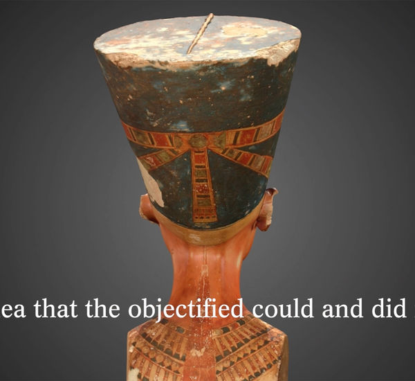 The back of a bust of Nefertiti, with a subtitle reading "the idea that the objectified could and did resist."
