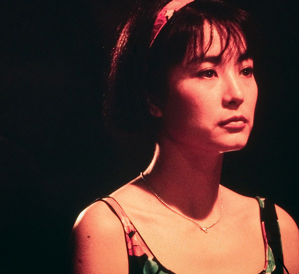 A woman turns her back to a man in a suit