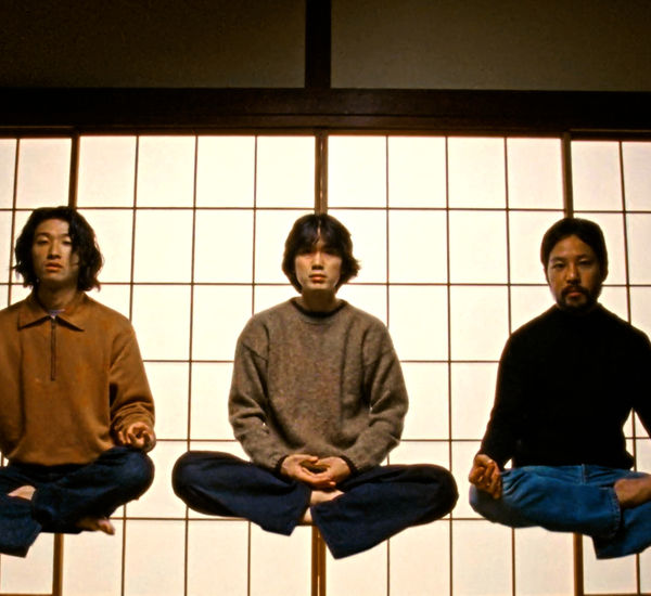 Three figures levitating while sitting cross-legged