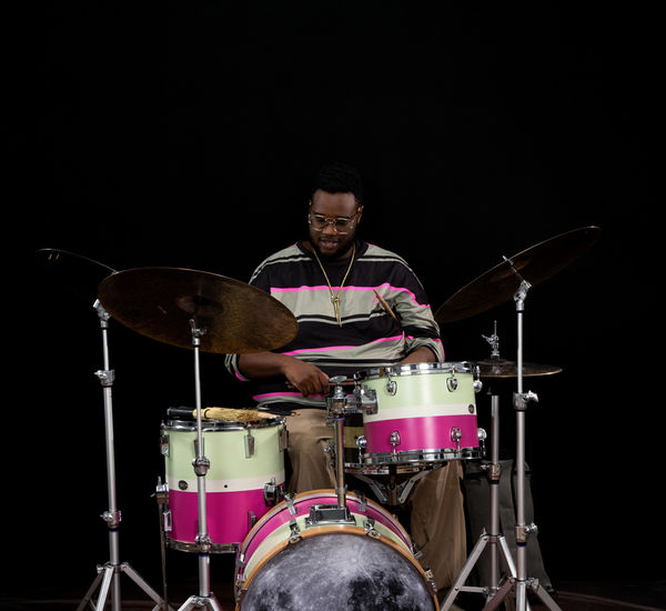 Machado Mijiga plays the drums