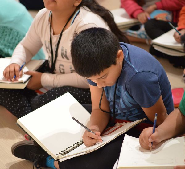 Kids writing in the galleries