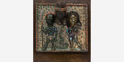 Dimensional sculpture with three figures in African garb