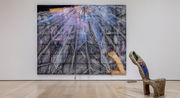 View of a gallery facing a large painting