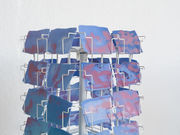 Postcard rack stocked with postcard-sized images of the sky