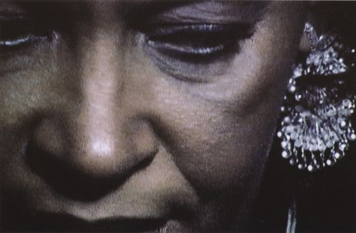 Close-up of a woman's face, looking down