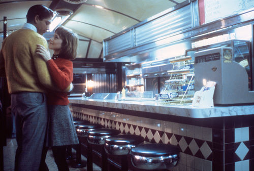 Still from the film Baby It's You (1983) showing a woman and a man embracing in a diner