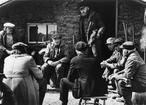 Still from the film Northern Lights (1978) showing a group of men seated in a circle for a meeting