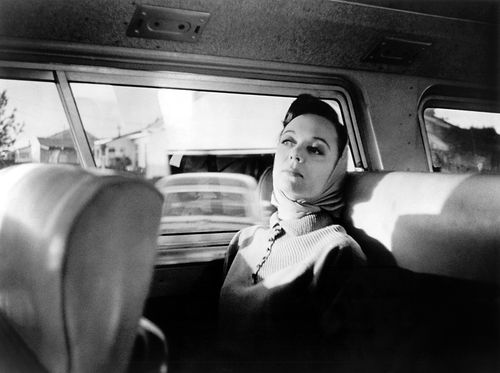 Still from the film The Savage Eye (1960), showing a woman in the backseat of a car