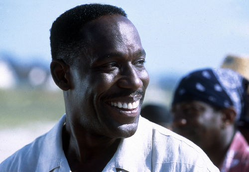 Still from the film Sunshine State (2002) showing a close-up of a man smiling