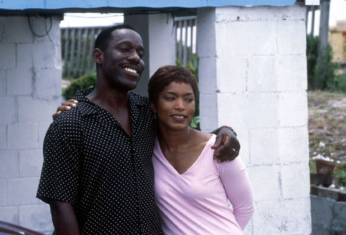 Still from the film Sunshine State (2002) showing a man and a woman hugging and smiling