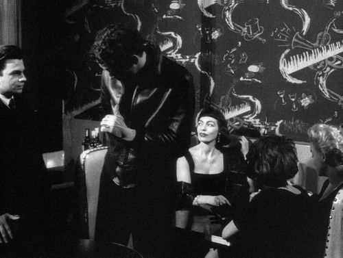 Still from the film Shadows (1961) showing a group of people socializing in a club