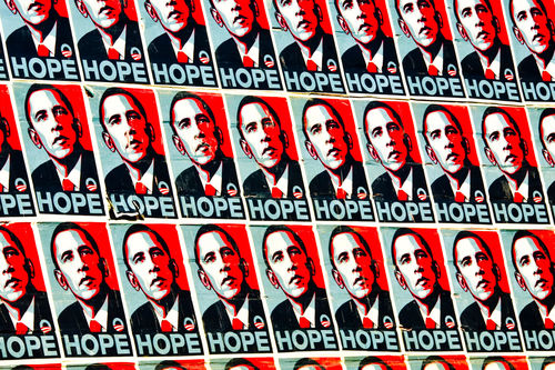 A wall covered in posters for President Obama