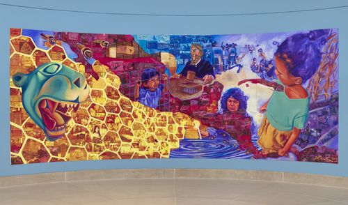 A colorful mural against a pale blue wall