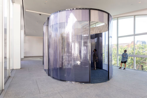 A large, oval structure with purple plastic sides