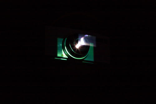 A screening room with an image of a projector