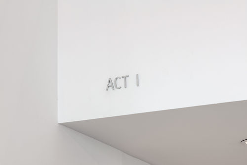 A white ceiling corner with ACT I embossed on it