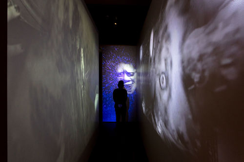 A hallway with projections on every wall