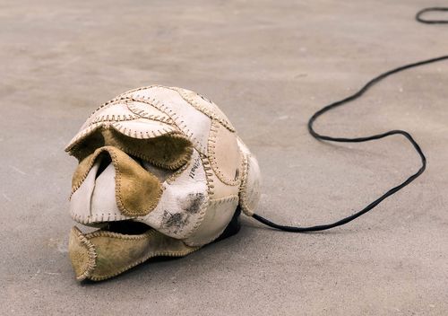 Brian Jungen, The Evening Redness in the West, 2006 (detail), baseballs, softballs, leather furniture, home theater system and DVDs, dimensions variable. 