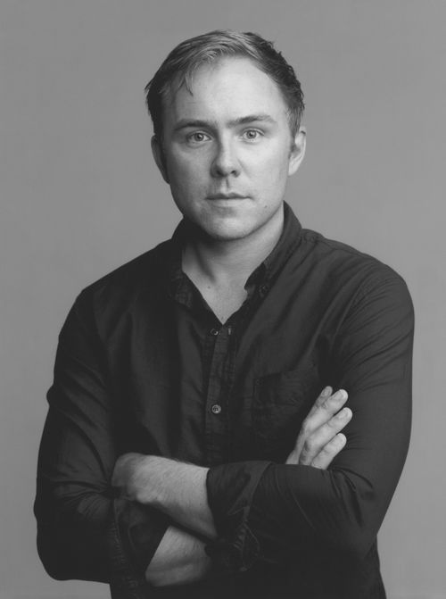 Black and white photo portrait of artist and author Justin Beal