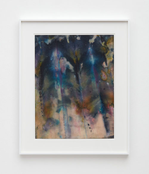 A framed artwork of abstract swirls of dark colors