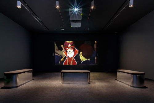 Dark gallery showing video of an anime character in red goggles saying "Regret vanishes."