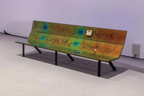 Bench with thermal map design and crackling painted on it.