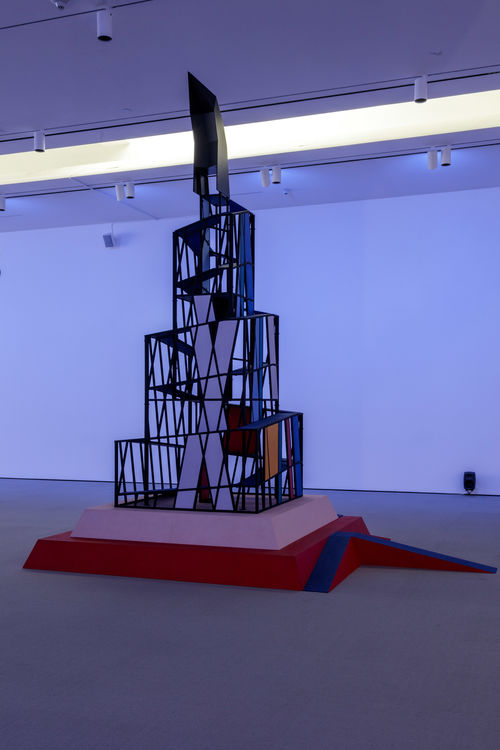 Tall cubist structure in gallery space.