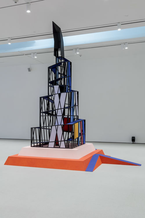 Tall cubist structure in gallery space.