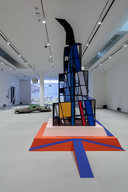 Tall cubist structure in gallery space.