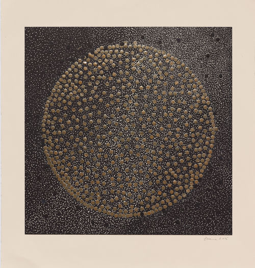 A square, geometric print of a circlemade of gold dots sits on a background of black-and-white spots