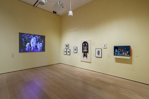 View of a gallery with artworks in a variety of media